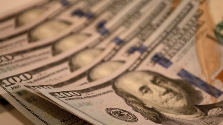 economic stimulus: six crisp $100 bills
