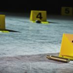 Crime scene markers on the floor of a parking garage