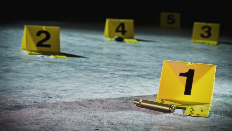 Crime scene markers on the floor of a parking garage