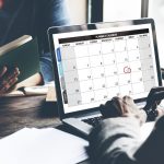 Closeup of computer laptop screen showing calenda with date and month